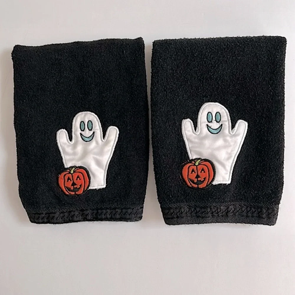 Halloween hand towels with a friendly ghost and pumpkin appliqué